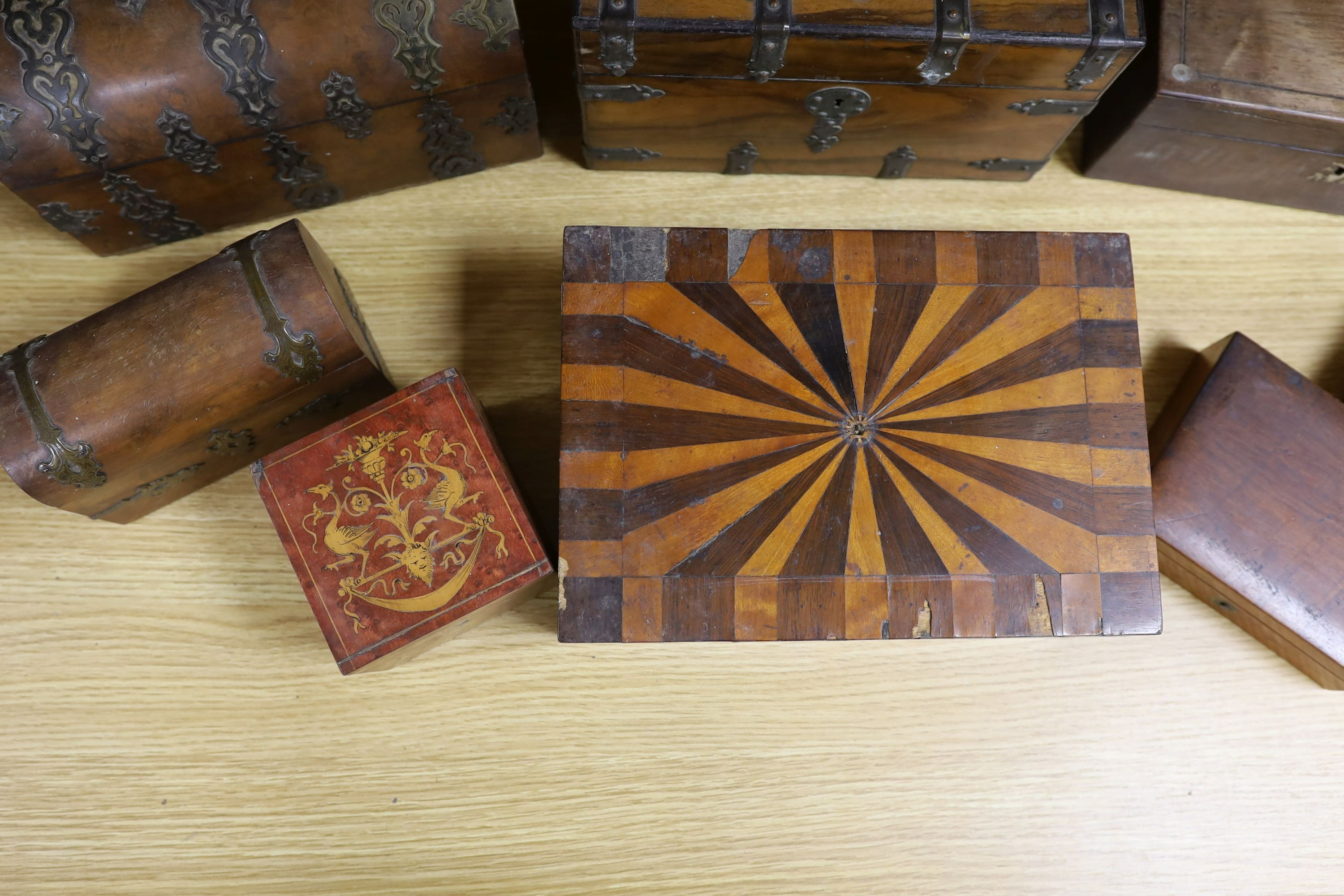 A Victorian Walnut and brass strap mounted tea caddy together with two caskets and five other boxes (8)